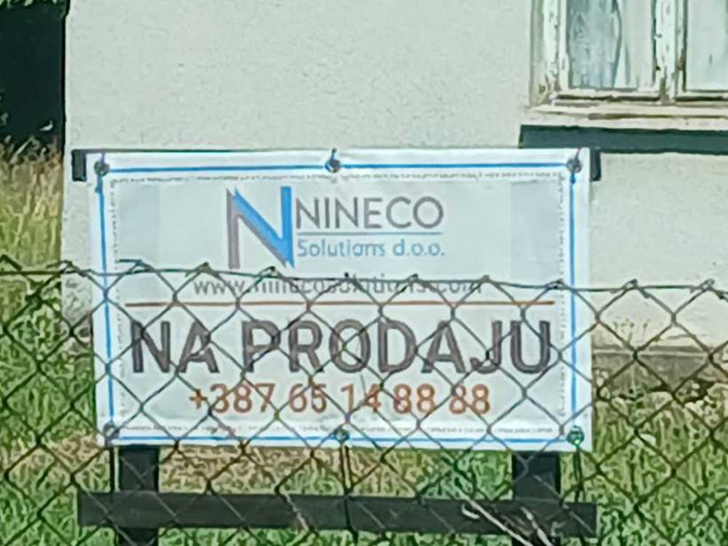 Local signage — Property board on the approach road, Banja Luka