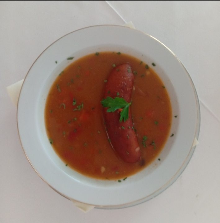 Kobasica u sosu — Bosnian sausage in tomato pepper broth, a classic regional comfort dish, Banja Luka