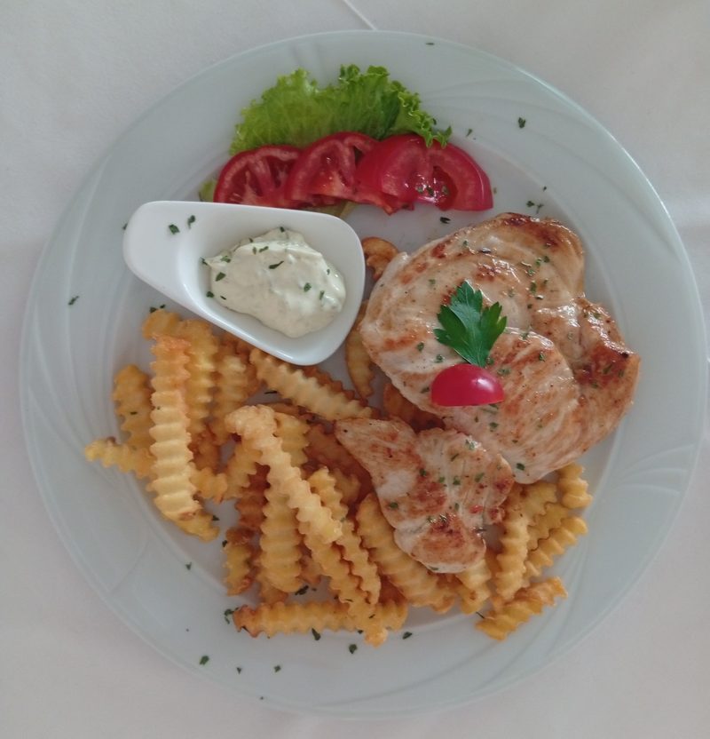 Grilled chicken with crinkle fries, kajmak, fresh tomato and lettuce — Bosnian grill plate, Banja Luka
