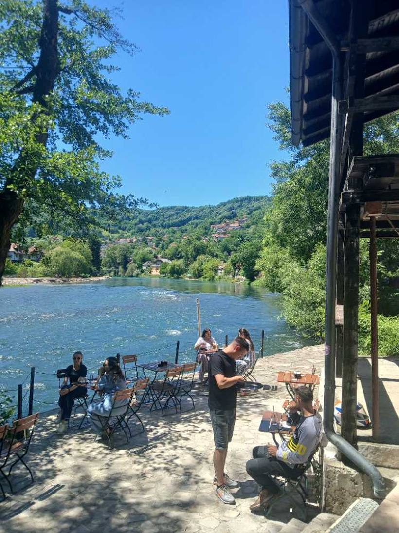 On the riverside deck — People in the water below, Banja Luka