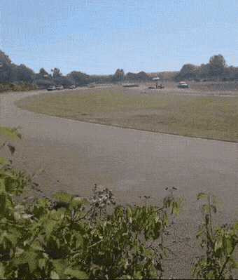 Kružna Trka 2026 — cars racing through the corner at Zalužani circuit, Banja Luka, animated